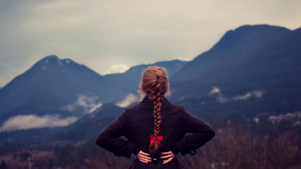 Woman staring out into the mountains