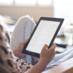Person holding and reading an ipad