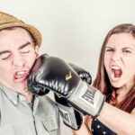 Woman punching a man in the face